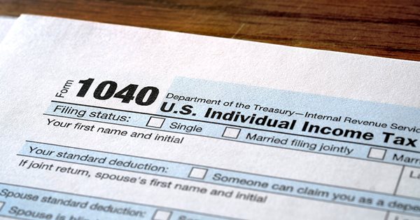 Close up of the top of a paper 1040 tax form