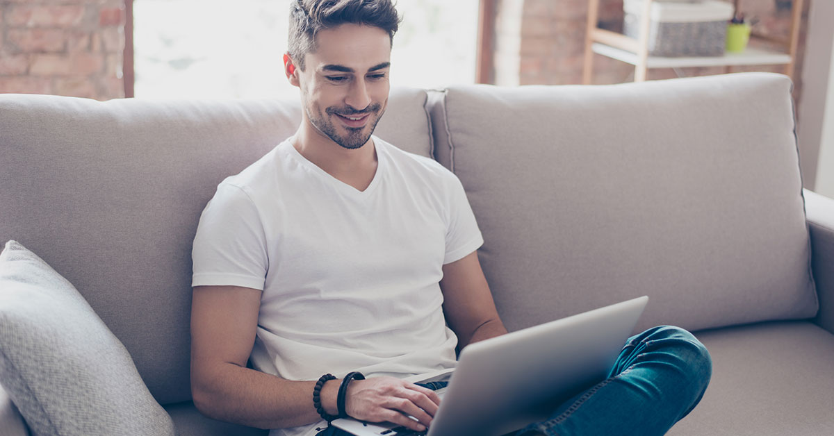 Man on his laptop signing up for online bill payments