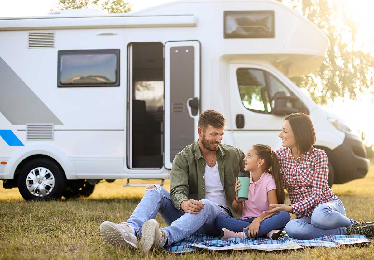 happy family in front of RV