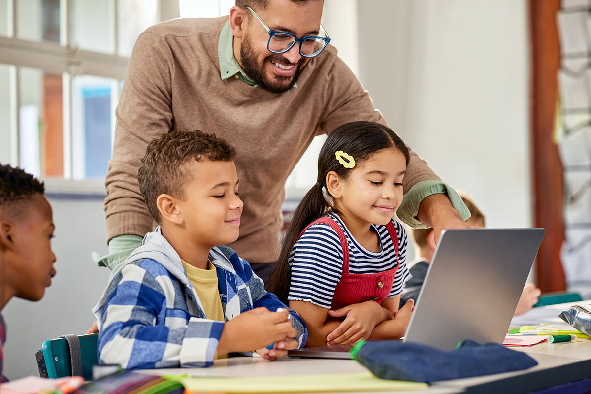 Students and Teacher with Laptop