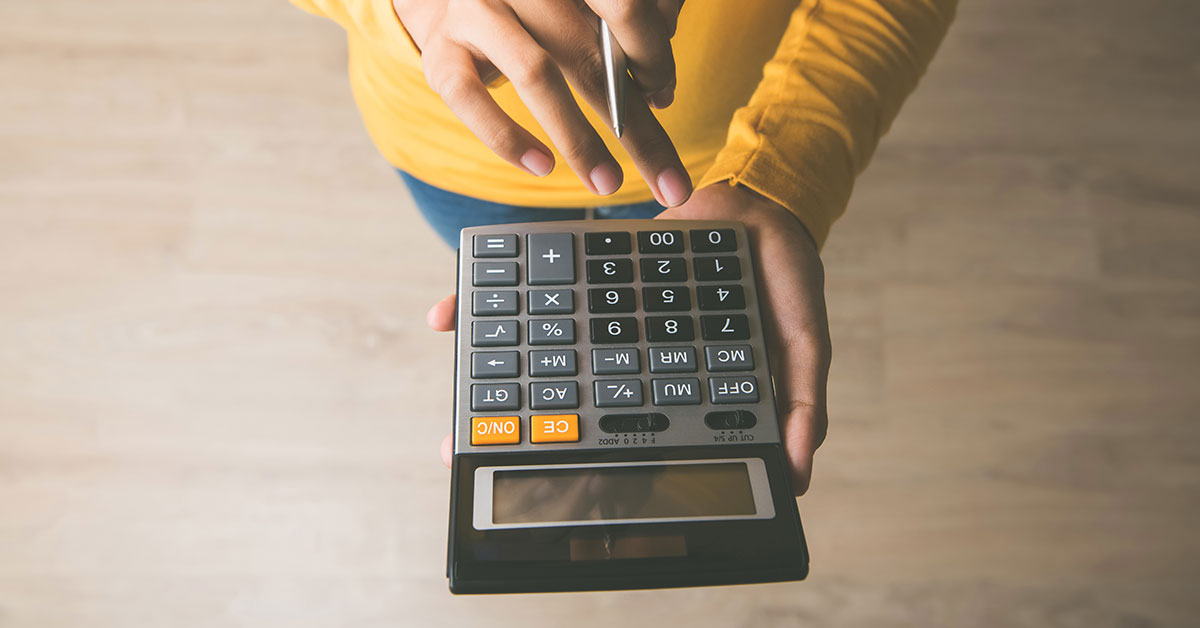 person holding a calculator