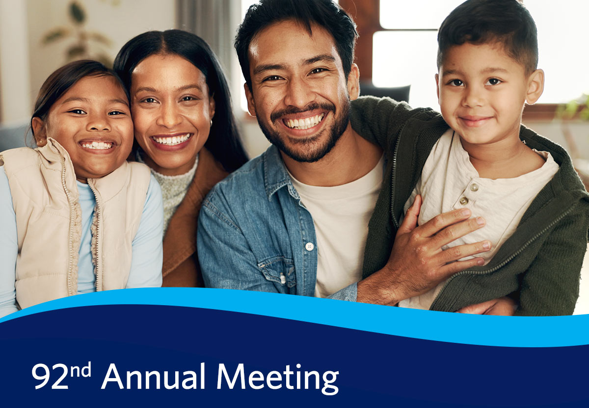 Smiling Family with Event Details for Annual Meeting