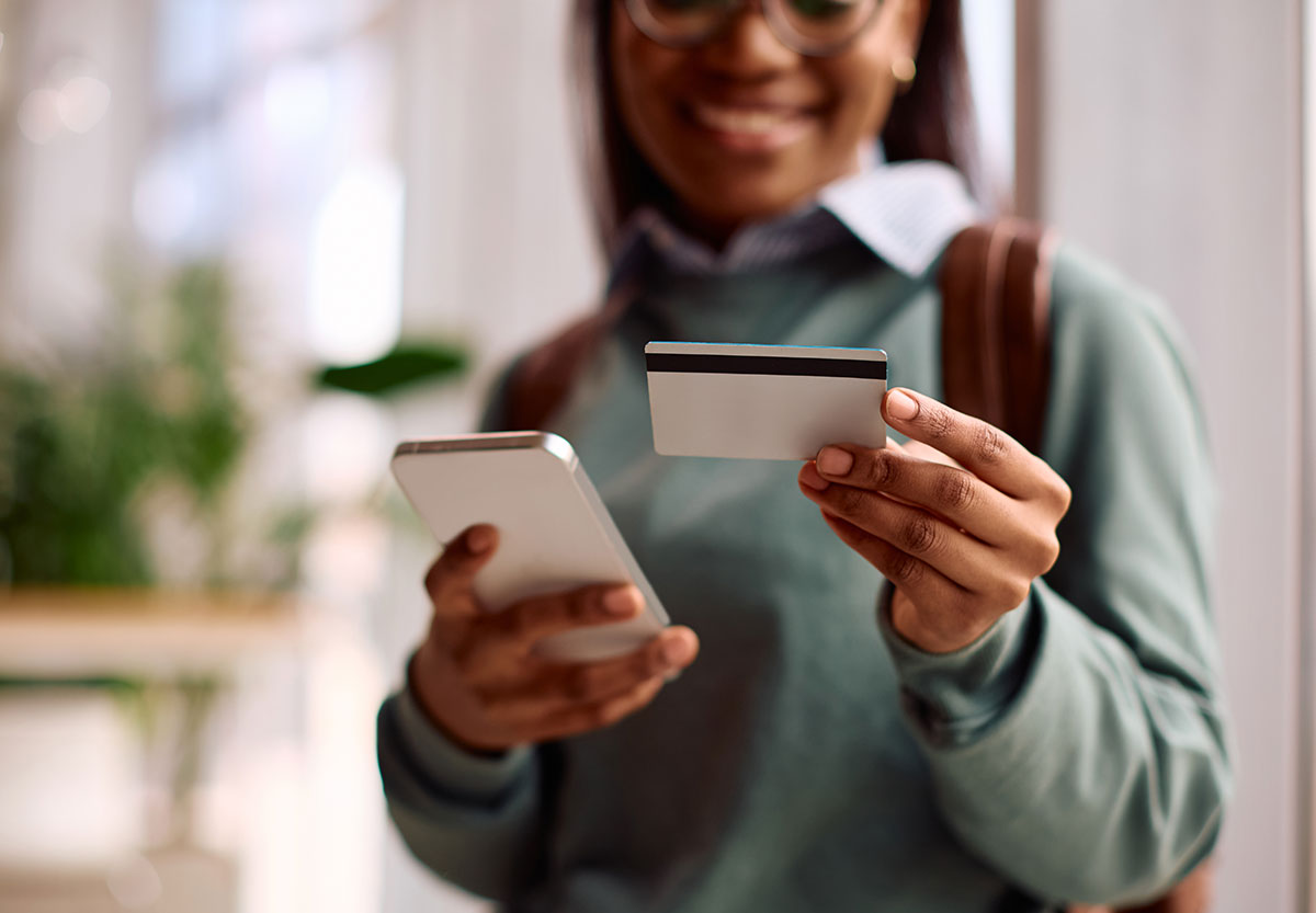 Young Woman with Phone and Credit Card