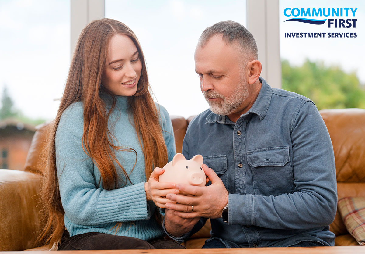 Young Woman and Man Holding Piggy Bank