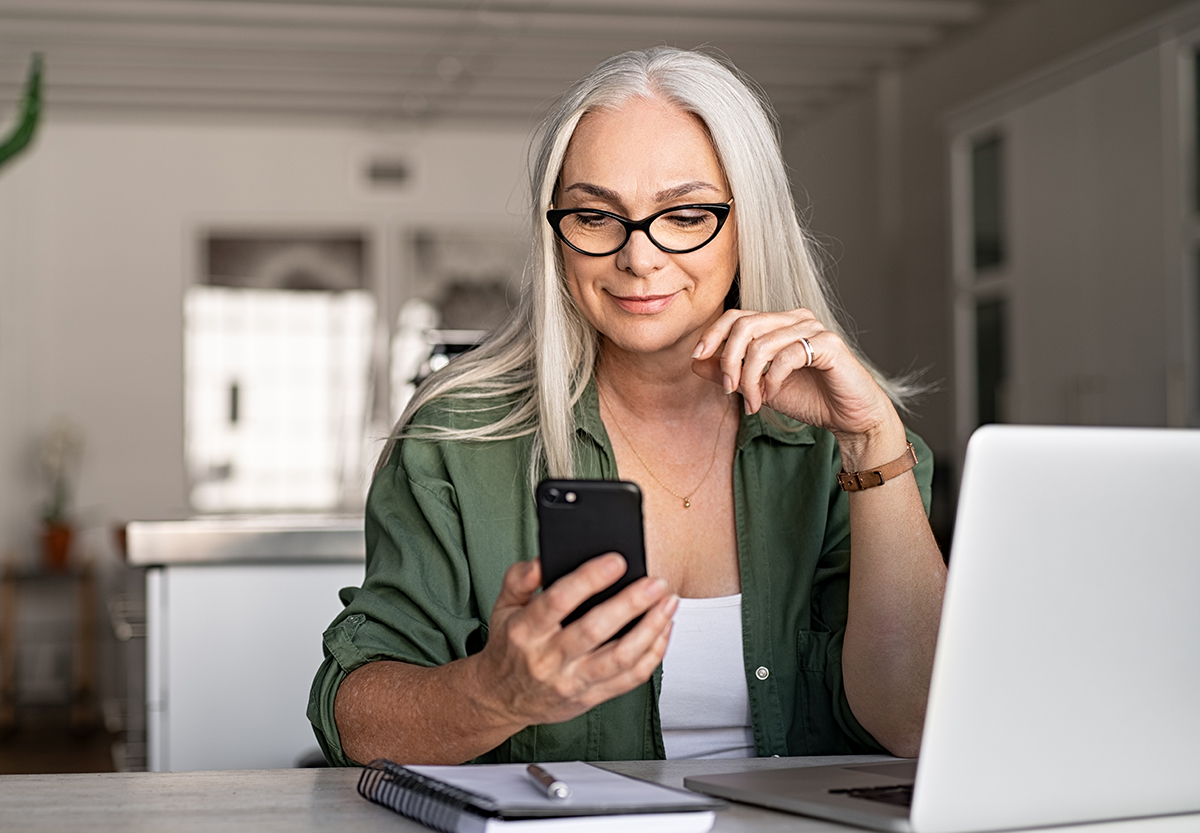 Woman smiling looking at her phone