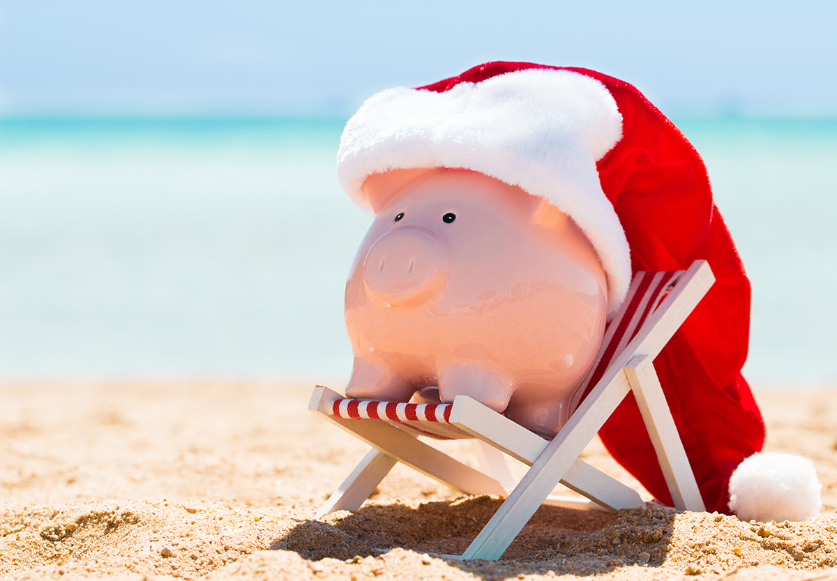 Piggy Bank with Santa Hat on Beach Chair