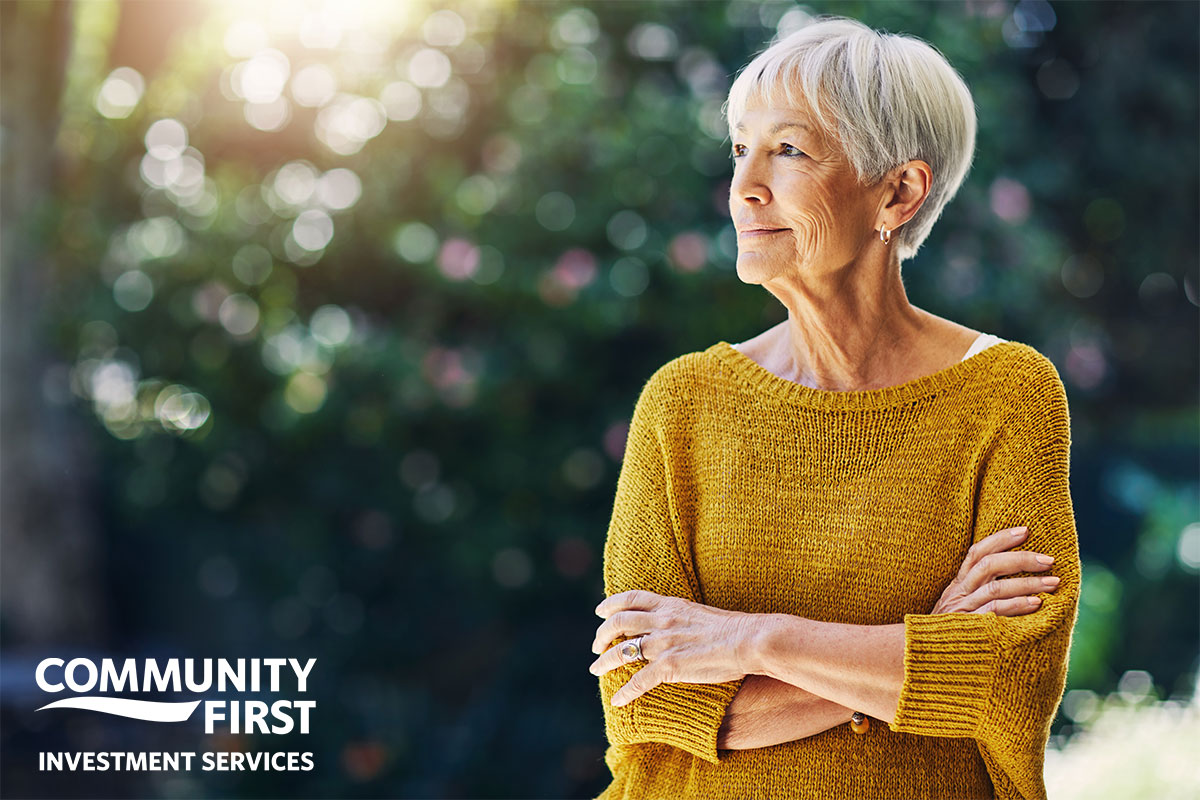 Woman with crossed arms smiling