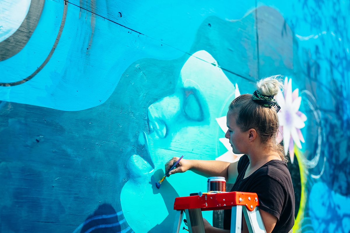 Artist Painting a Mural