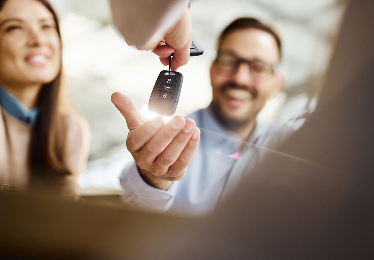 Man Receives keys to new auto