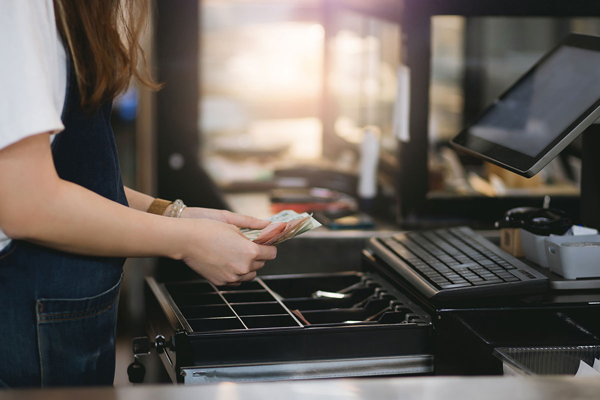 Woman Using Cash Register