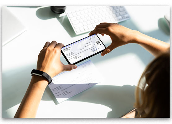 Person Taking Photo of a Check with their Mobile Phone