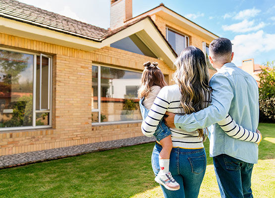Family in Front of New House