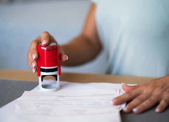 Notary stamp in hand