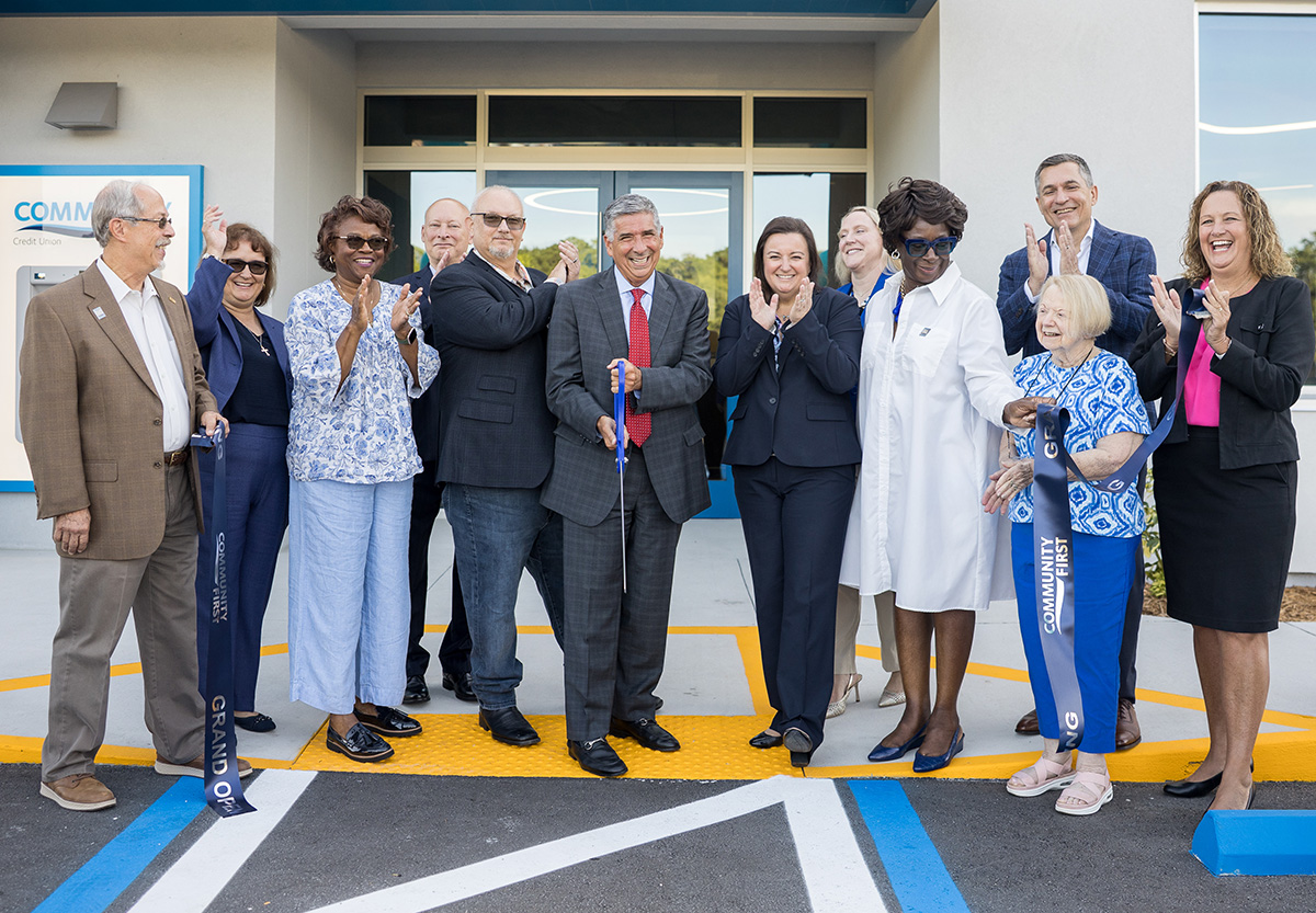 Sam Inman CEO Cuts Ribbon to New Branch
