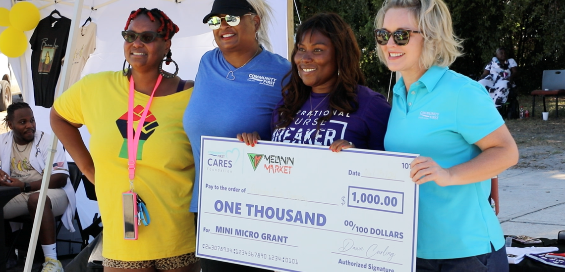 Small Business Owners and Missy Peters with Big Check
