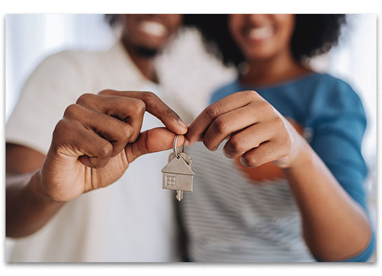 Hands holding house keys
