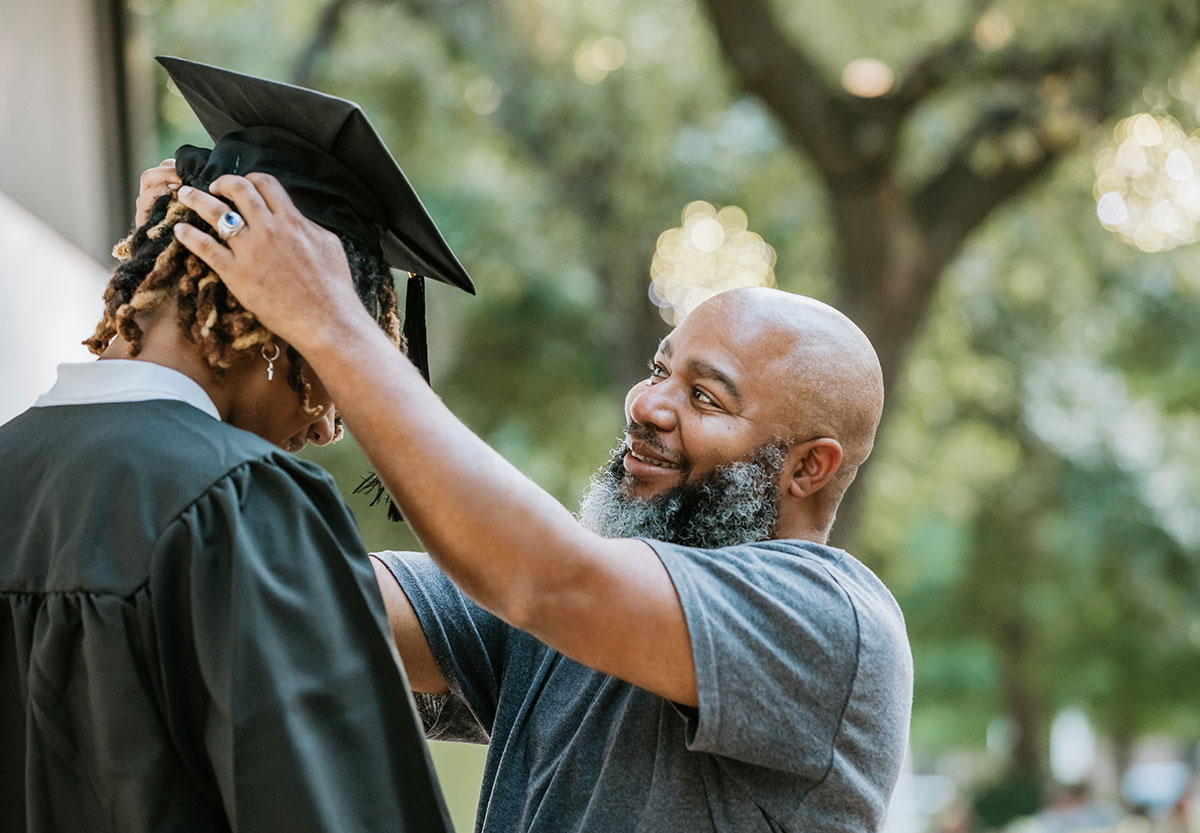 Father Straightening his son's graduation cap