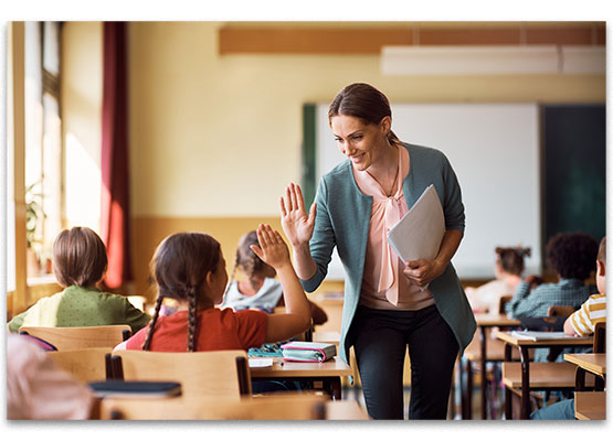 Teacher gives student high five