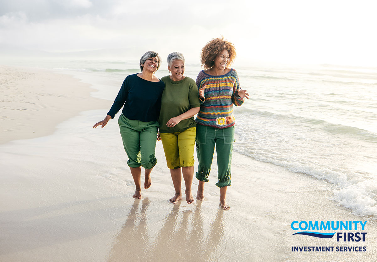 Three Women Walking a Shoreline