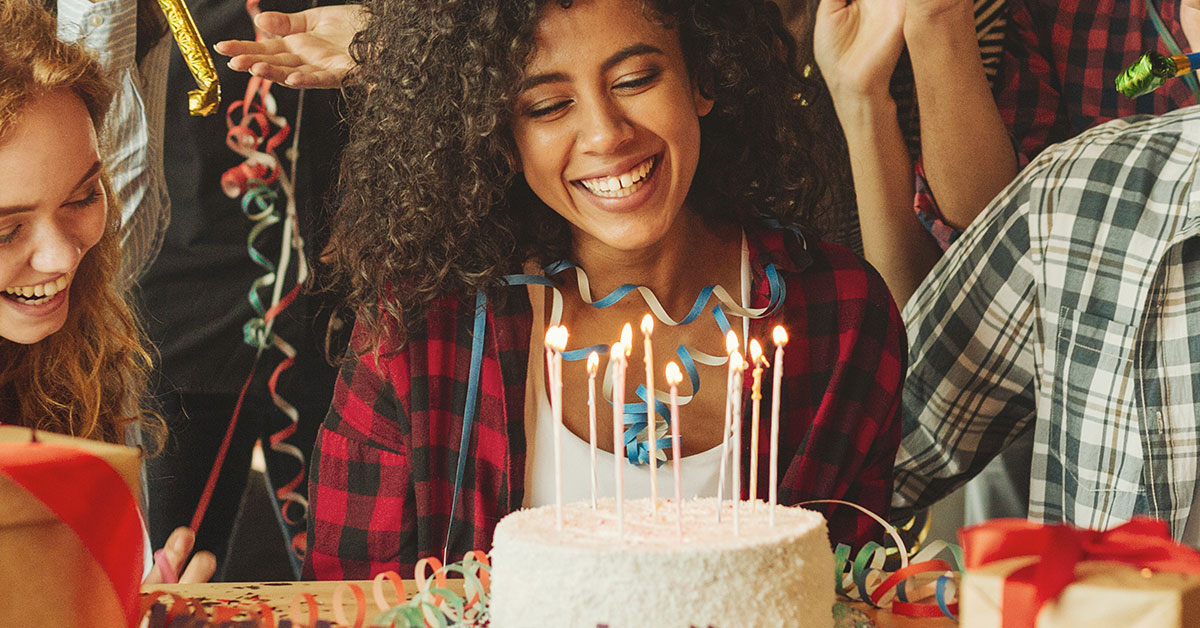 Young woman and her friends celebrating her 18th birthday